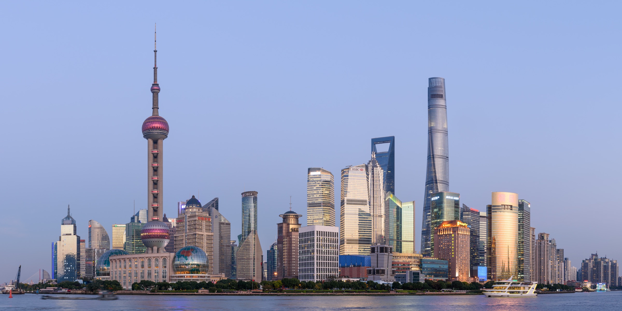 The Shanghai skyline and Huangpu River at dusk